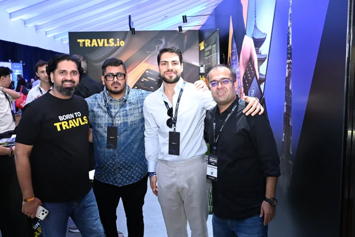 Travls team in conversation with visitors at the Singapore booth