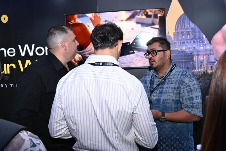 Travls team members talking with visitors at the Singapore event