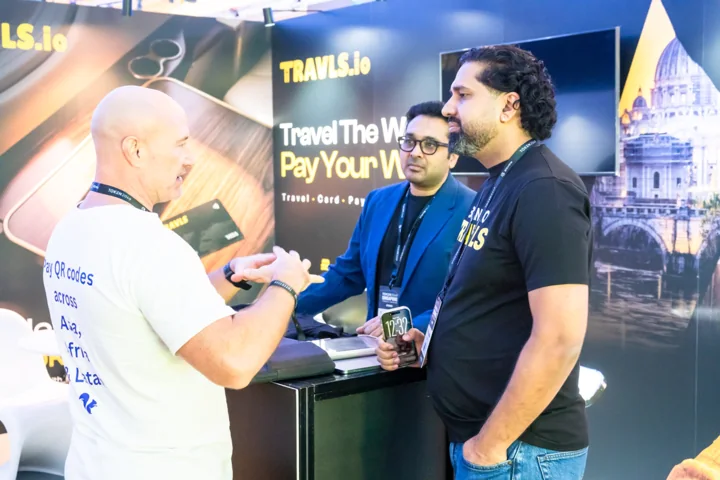 Travls team introducing the platform to visitors at TOKEN2049 Singapore