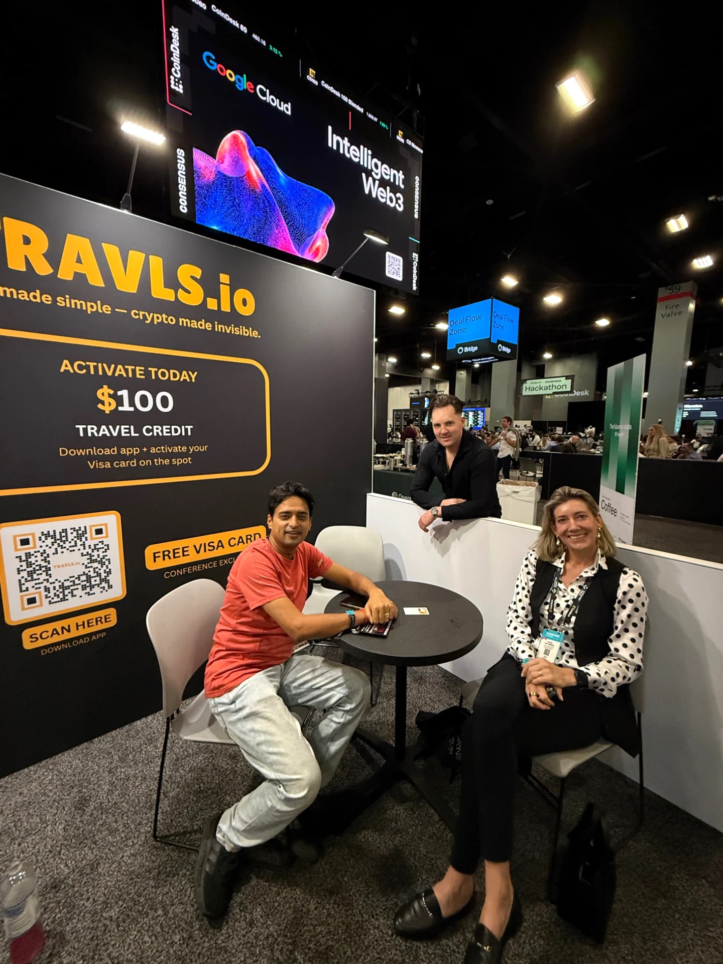 Travls exhibition stand with two guests at Consensus Miami
