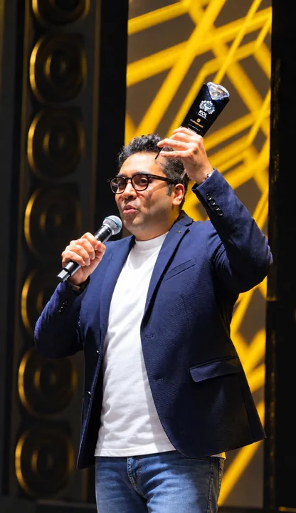 A Travls representative speaking on stage during the Singapore KOL Capital Awards