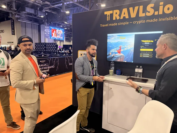 Guests discussing Travls travel services at BTC Vegas
