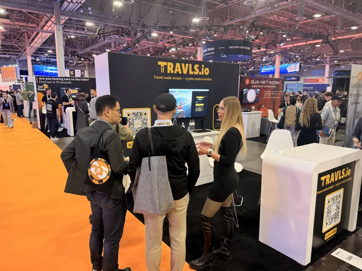 A group of visitors exploring Travls on the BTC Vegas exhibition floor